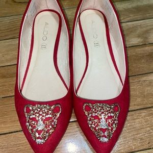 Brand new Aldo women’s shoes. Never worn. Bright red gold & silver Lion design.